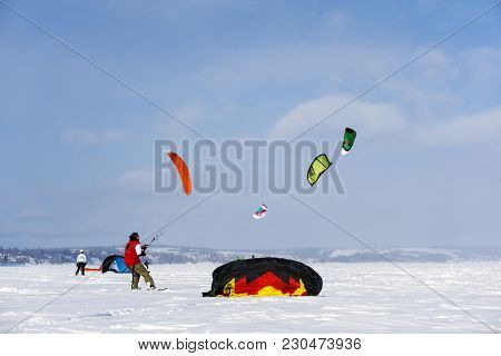Perm, Russia - March 09, 2018: Snowkiters Rides On The Ice Of The Kama Reservoir