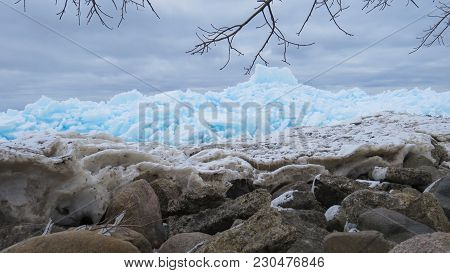 Beautiful turquoise blue ice flows on the shore of Georgian Bay in Meaford, Ontario, Canada