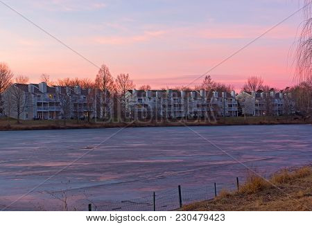 Pastel Colors Of Winter Sunset At Lake Waterfront In Falls Church, Virginia, Usa. Colorful Sunset In