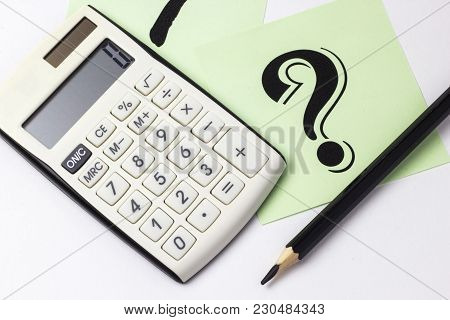 Close Up Of Calculator, Instrument Of Measurement And Pencils