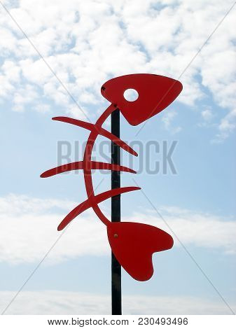 Red Skeleton Of Fish Decoration In The Sky