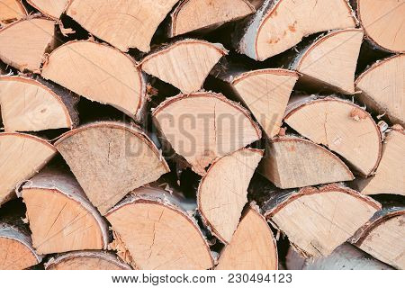 Wooden Background - Closeup. Firewood For The Winter, Stacks Of Firewood, Pile Of Firewood. Firewood