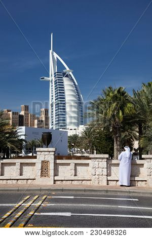 DUBAI, UAE - FEBRUARY, 2018: View on Burj Al Arab, the world only seven stars hotel seen from Madinat Jumeirah, a luxury resort which include hotels and souk spreding across over 40 hectars.