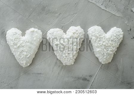 Sweet Crunchy Coconat Heart-shaped Biscuits Arranged In Pattern On Light Textured Background, Top Vi