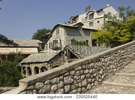 Mostar, Bosnia And Herzegovina - August 17 2017: Ancient Buildings On The Riverside Of Old Kriva Cup