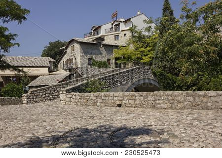 Mostar, Bosnia And Herzegovina - August 17 2017: Ancient Cobblestone Square In Mostar Near An Old St