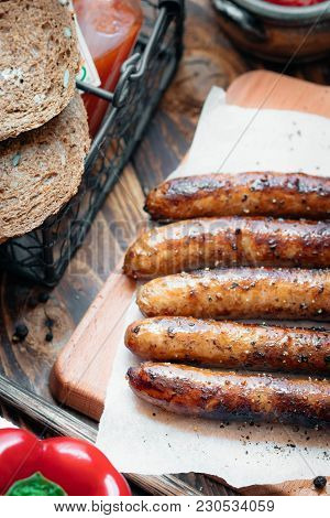 Pork Chipolata. Close-up View Of Fried Sausages. Meat Dish.