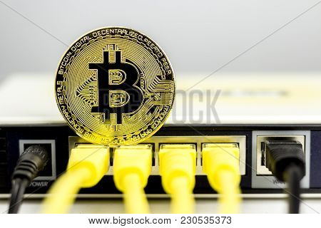 Bitcoin Coin On The Back Of A Router, Symbolizing It's A Web Money.
