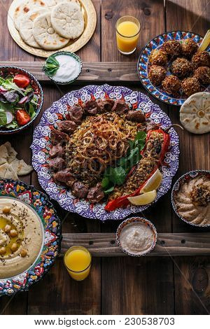 Middle Eastern Or Arabic Dishes And Assorted Meze On A Dark Background.