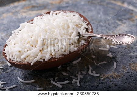 Chocolate Egg With Filling For Easter On Wooden Background