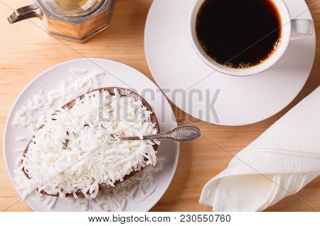 Chocolate Egg With Filling For Easter On Wooden Background