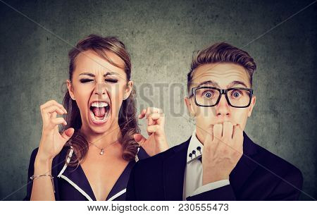 Angry Mad Woman Screaming And Fearful Stressed Man