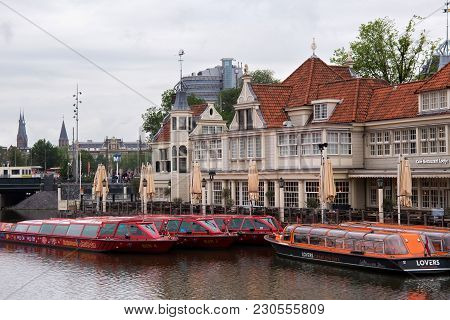 Amsterdam, Netherlands - June 25, 2017: Tourist Information Office And Cafe-restaurant Loetje Near A