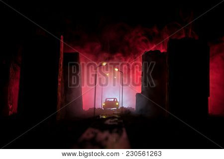 Empty Street Of Burnt Up City, Flames On The Ground And Blasts With Smoke In The Distance. Apocalypt