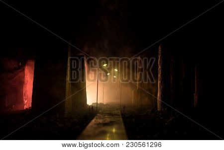 Empty Street Of Burnt Up City, Flames On The Ground And Blasts With Smoke In The Distance. Apocalypt