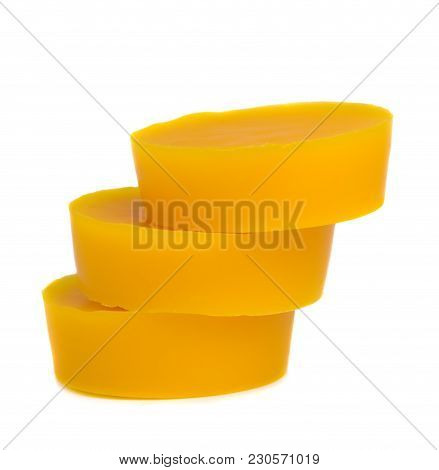 Pieces Of Natural Beeswax Are Isolated On A White Background. Beekeeping Products. Apitherapy