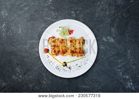 Sushi Philadelphia Royal Served On The White Plate With Grey Plastered Background, Top View. Japanes
