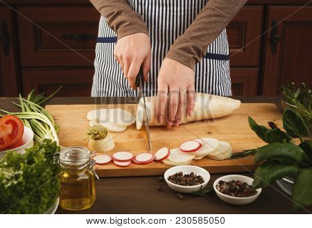 Woman Cutting Fresh Turnip On Wooden Board. Natural Eating, Preparing Healthy Dietic Vegetable Salad