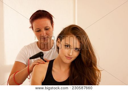 Physiotherapist Doing Tecar Therapy Alterantive Treatment On A Woman Patient