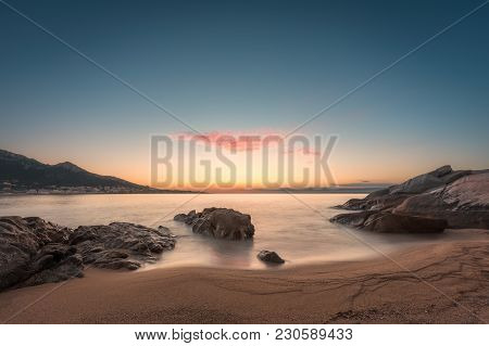 Sunset On Sandy Algajola Beach In Corsica