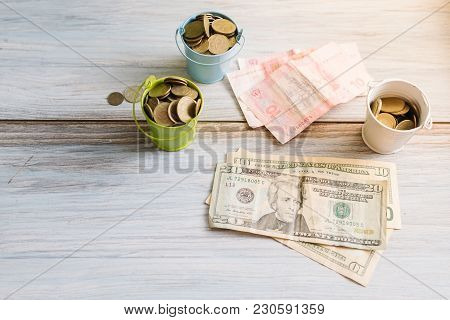 American Dollars And Ukrainian Hryvnia On A White Background Isolates.