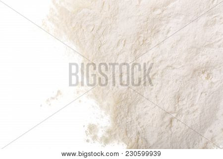 Pile Of Flour Isolated On White Background With Copy Space For Your Text. Top View. Flat Lay.