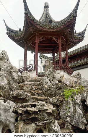 A Gazebo On Rocks Within The Classical Chinese Li Yuan Garden In Zhaojialou Shanghai China.