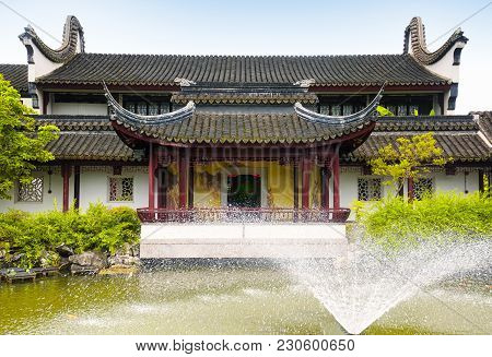 A Water Fountain And Covered Corridor At The Classical Chinese Li Yuan Garden In Zhaojialou In Shang