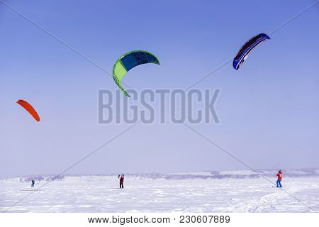 Perm, Russia - March 09, 2018: Snowkiters Rides On The Ice Of A Frozen River