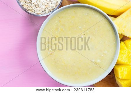 Mango, Banana, Pineapple And Oatmeal Smoothie In The Bowl