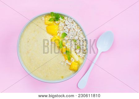 Mango, Banana, Pineapple And Oatmeal Smoothie In The Bowl