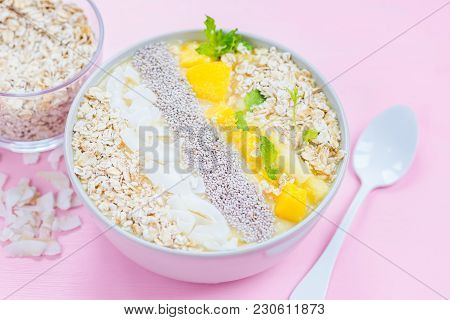Mango, Banana, Pineapple And Oatmeal Smoothie In The Bowl