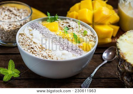 Mango, Banana, Pineapple And Oatmeal Smoothie In The Bowl