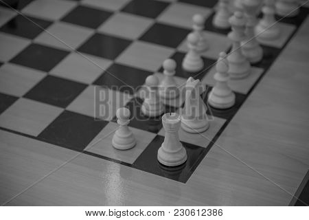 Chess Club With Long Tables. Wooden Chess Board With Wooden Chess Pieces And Chess Clock. Close Up. 