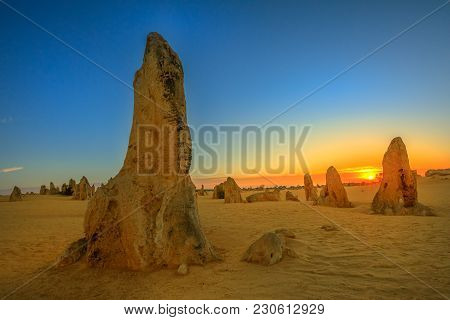 Giant Limestone Formation At Dusk. The Pinnacles Desert In Nambung National Park, Offers, At Sunset,