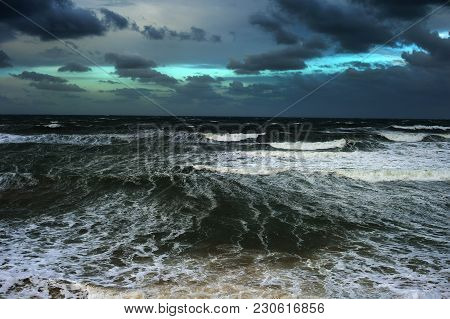 Stromy Ocean With Heavy Clouds In The Day. Portugal