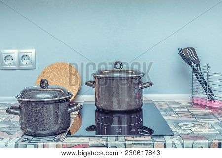 Empty Sausepan On Stove With Stands On Table Closeup