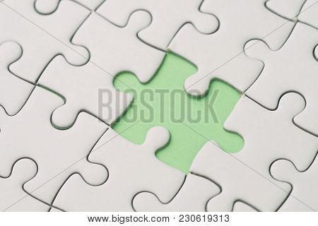 Missing Piece For Business Success Strategy Metaphor Concept, Closed Up Of White Jigsaw Puzzle Missi