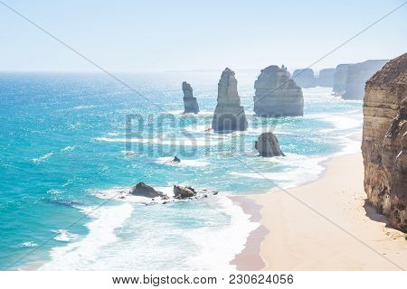 Twelve Apostels, Cliffs, Beach With Backlight The Great Ocean Road, Victoria, Australia