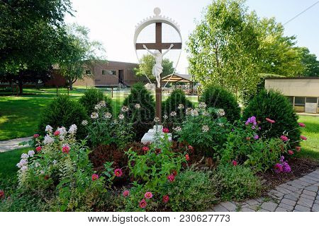 Joliet, Illinois / United States - July 27, 2017: A Sculpture Of Jesus Christ, Nailed On A Cross, In