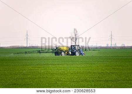 Tractor Making Fertilizer By Spray. Work Agricultural Machines.
