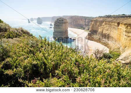 Cliffs And Green Bushes At Twelve Apostels With Backlight At The Great Ocean Road, Victoria, Austral