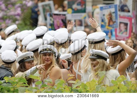 Stockholm, Sweden - Jun 13, 2017: Smiling Students Wearing White Graduation Caps After Graduation At