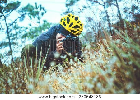 Photographer  Asian Men Travel  Nature. Travel Relax.  Nature Study In The Jungle. Eriocaulon Henrya