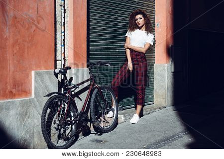 Arab Girl In Casual Clothes In The Street. Girl Power Concept.