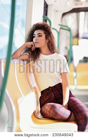Arab Woman Inside Metro Train. Arab Girl In Casual Clothes.