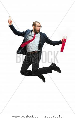 Funny Cheerful Businessman Jumping In Air Over White Studio Background. Jump Of Happy Bearded Young 