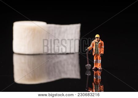 Bandage Used For Injuries During Work, Leisure Time Or In Housework, Isolated On Glossy Black Backgr