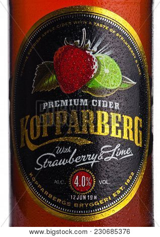 London, Uk - March 10, 2018 : Cold Bottle Label Of Kopparberg Premium Cider With Strawberry And Lime