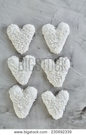 Sweet Crunchy Coconat Heart-shaped Biscuits Arranged In Pattern On Light Textured Background, Top Vi